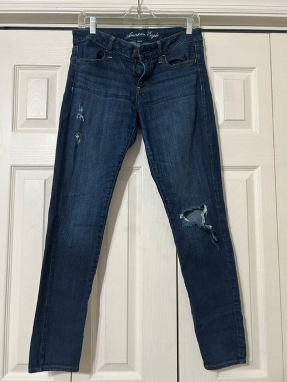 American Eagle dark-wash stretch jeggings feature light knee distress. (6)